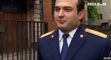 Марат Тамбиев в форме сотрудника СК, кадр из видеоматериала